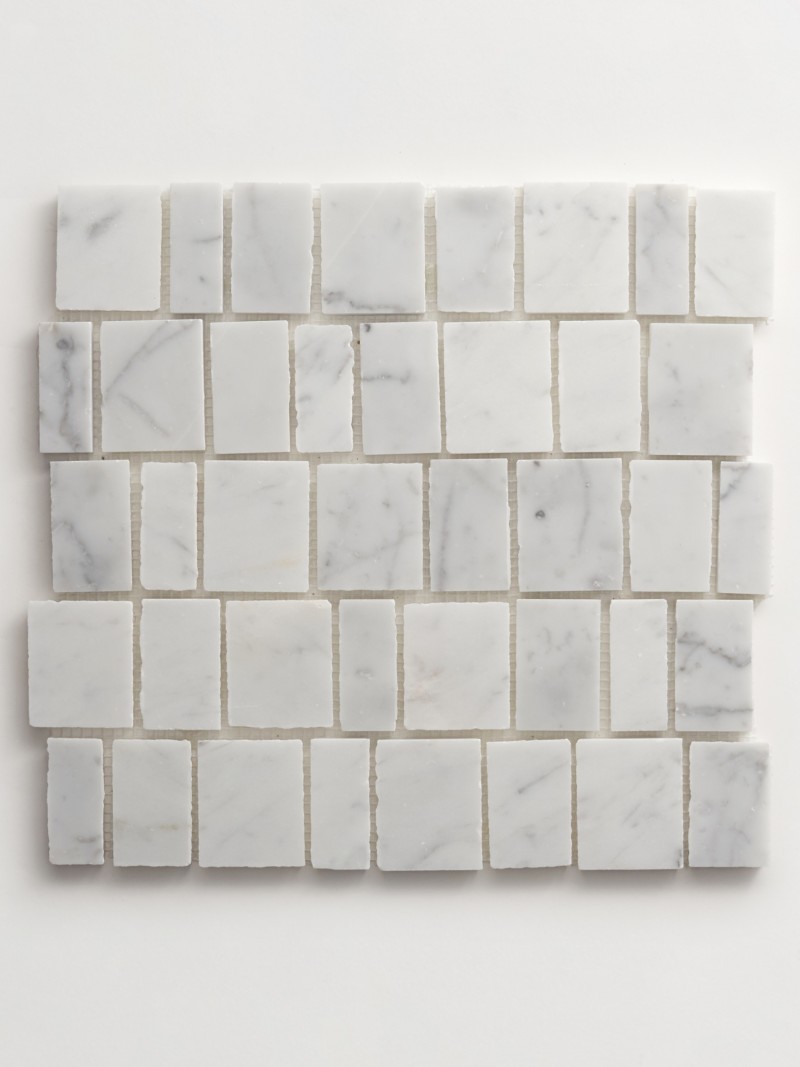 a white marble mosaic tile on a white surface.