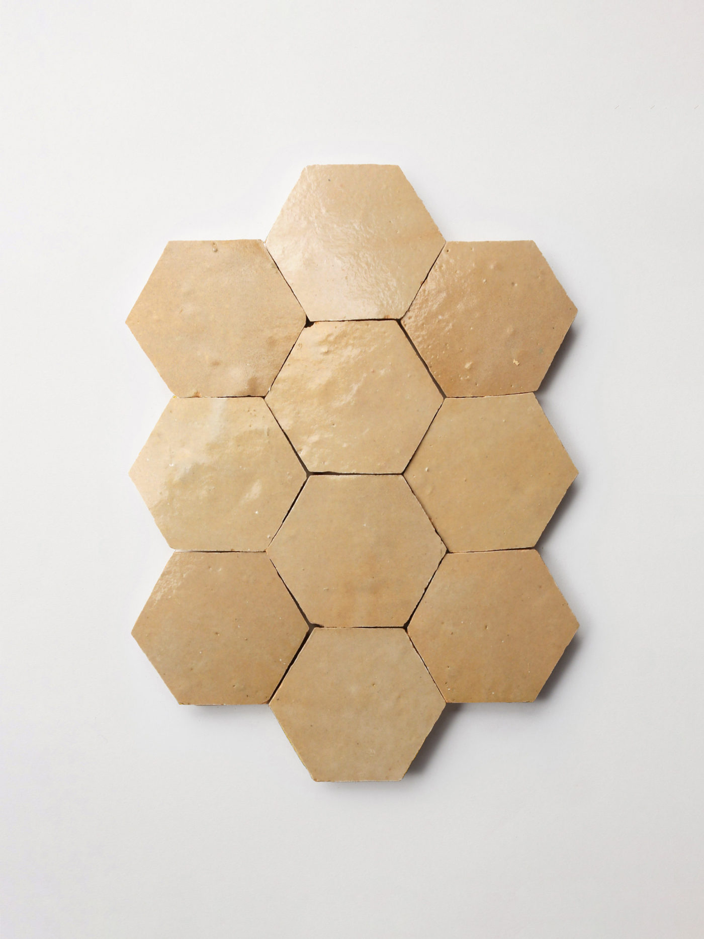 beige hexagonal tiles on a white background.