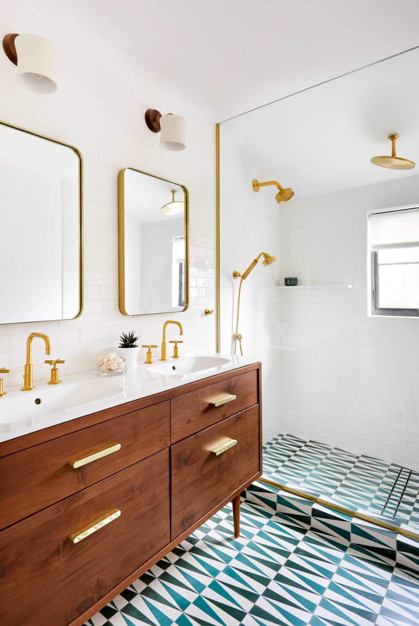 a bathroom with a blue and white tiled floor.