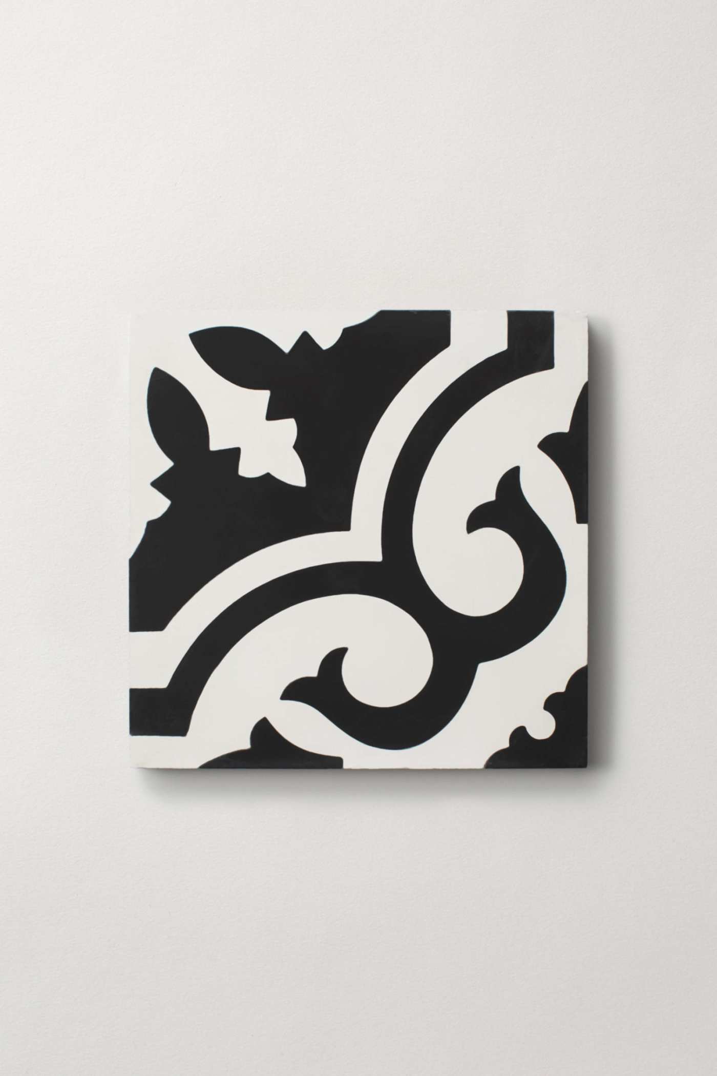 a black and white tile on a white surface.