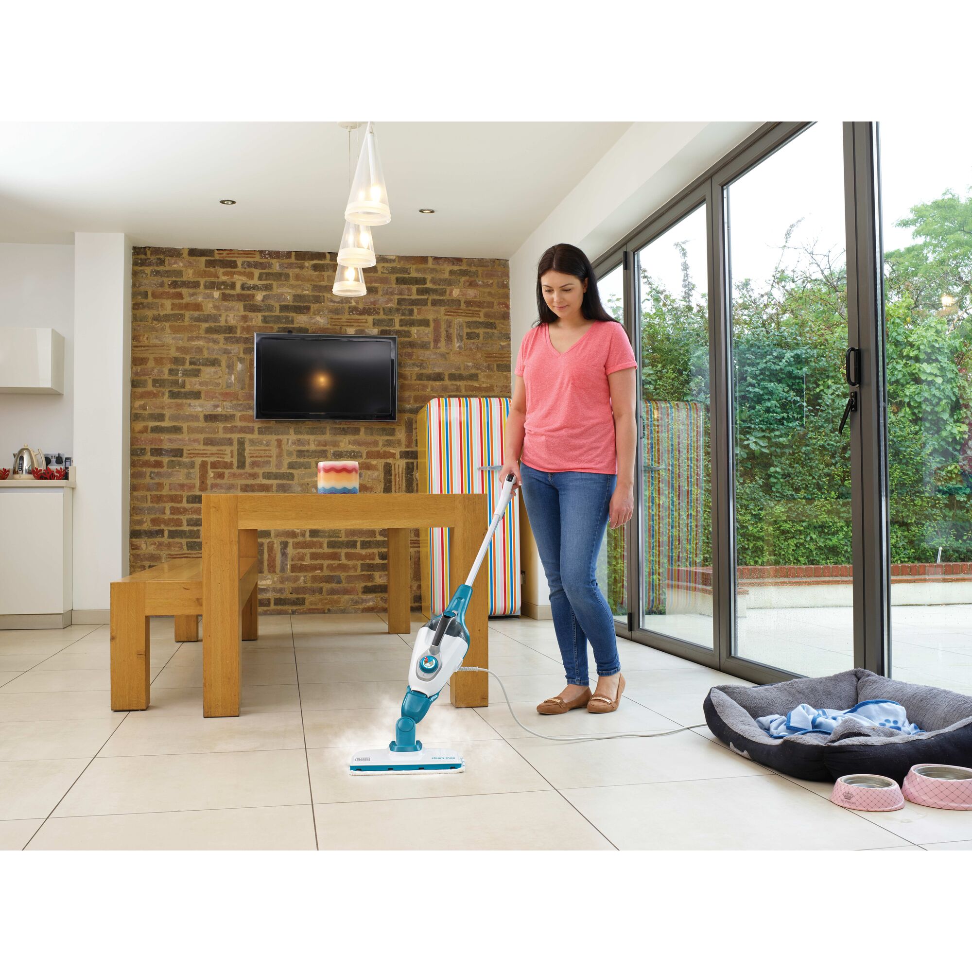 5 in 1 Steam Mop and Portable Steamer being used by person to clean floor tiles of house.