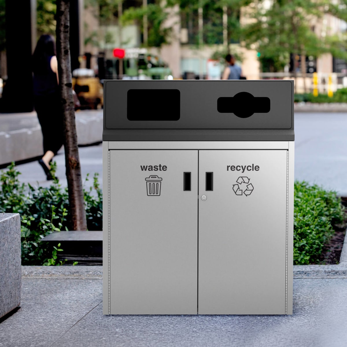 metal waste and recycling container outside a downtown office building