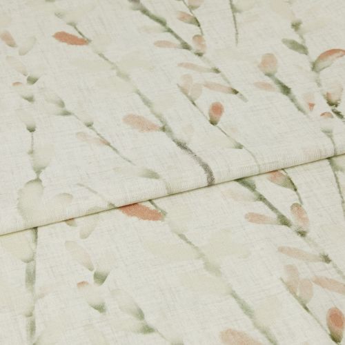 Cream linen-look curtain fabric with soft green stems and peach buds, folded across the frame, overlapping at the center; close-up view with gentle, diffuse lighting showing woven texture.
