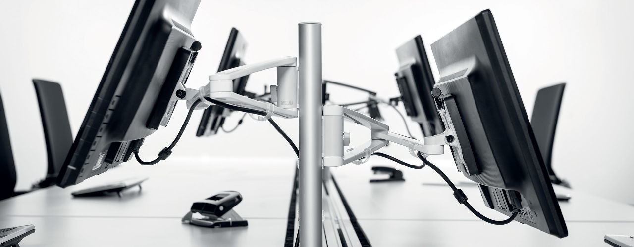 Novus MY monitor arms elevate monitors and tablets for a comfortable viewing position while maximizing available workspace.