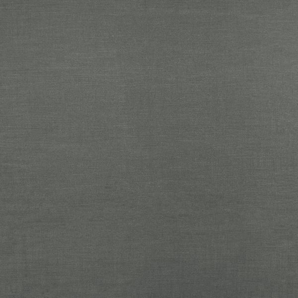 Dark gray woven fabric roller blind, fully lowered and smooth; filtering light and blocking view; fills the frame with uniform texture under neutral indoor lighting, no other room features visible.