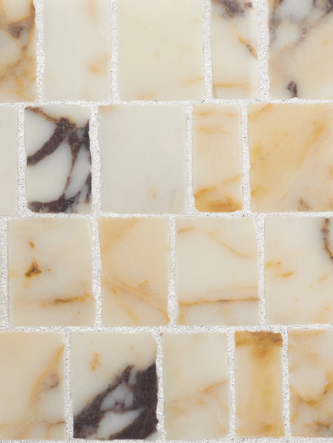 a close up of a white and brown marble tile.