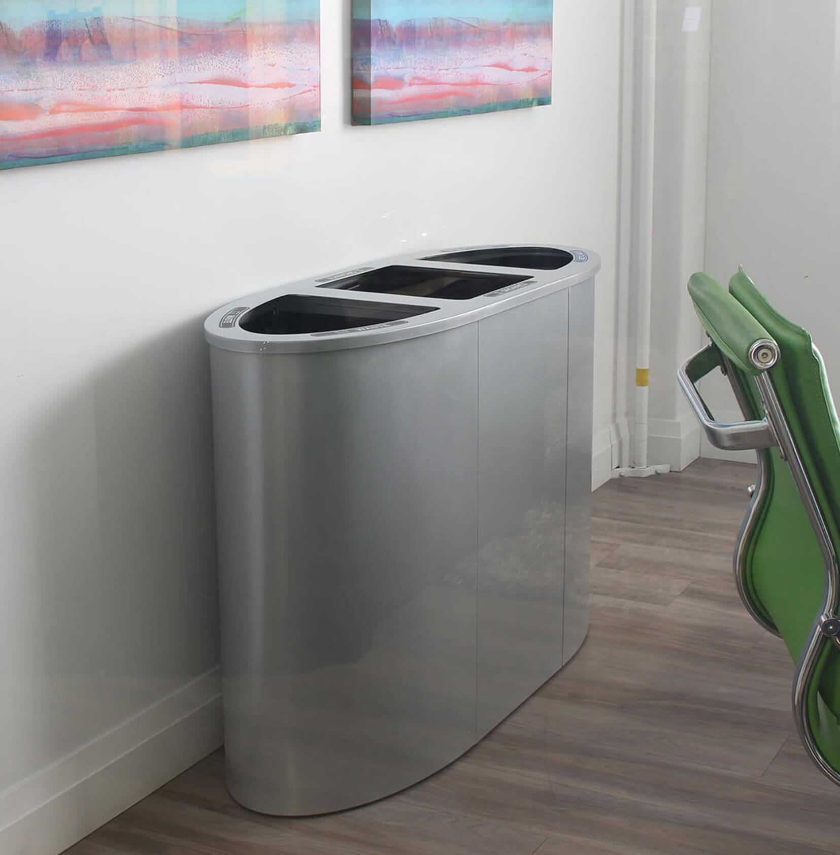 indoor powder coated steel triple stream waste and recycling container in a modern office