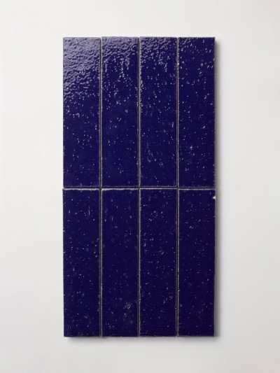 a blue tile on a white background.