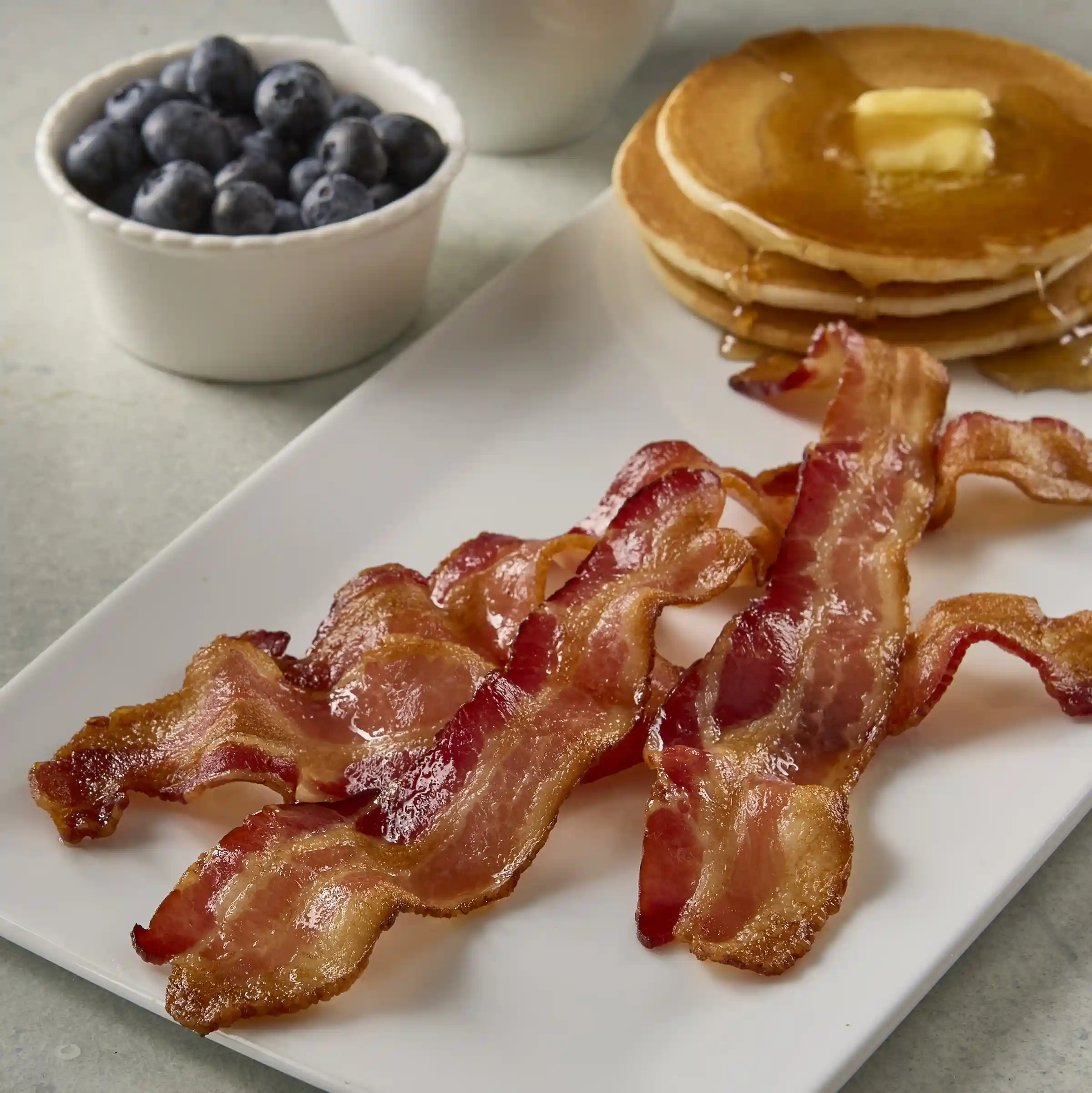 Wright® Brand Naturally Hickory Smoked Regular Sliced Flat-Pack® Bacon, 15 lbs, 14-18 Slices per Pound, Gas Flushed https://images.salsify.com/image/upload/s--0ygBq32W--/q_25/31a93c4ef04a087e6863602001a5341b3912eae3.webp