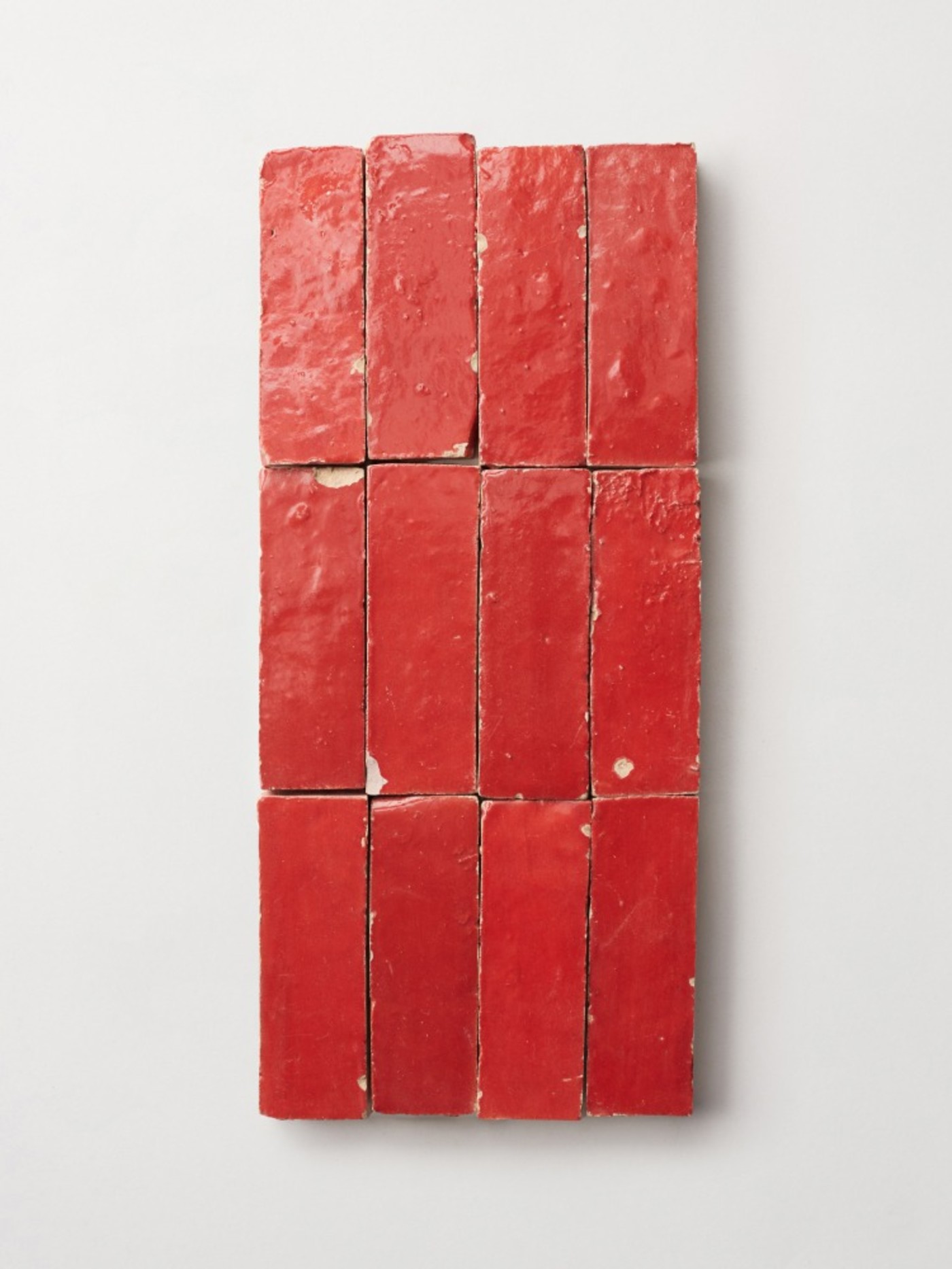 red tiles on a white surface.