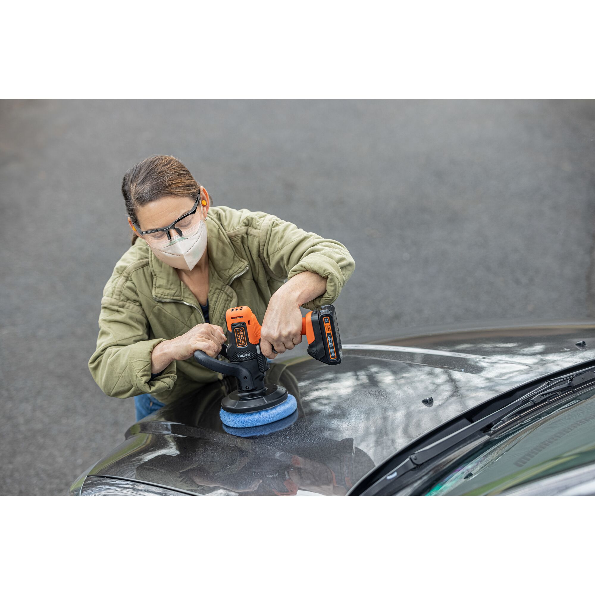 Person uses the BLACK+DECKER MATRIX buffer attachment to polish a car hood.