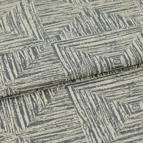 Woven upholstery fabric, cream base with gray, hand-drawn concentric-square pattern, folded over itself; photographed close-up under neutral studio lighting, showing textured weave and a layered edge.
