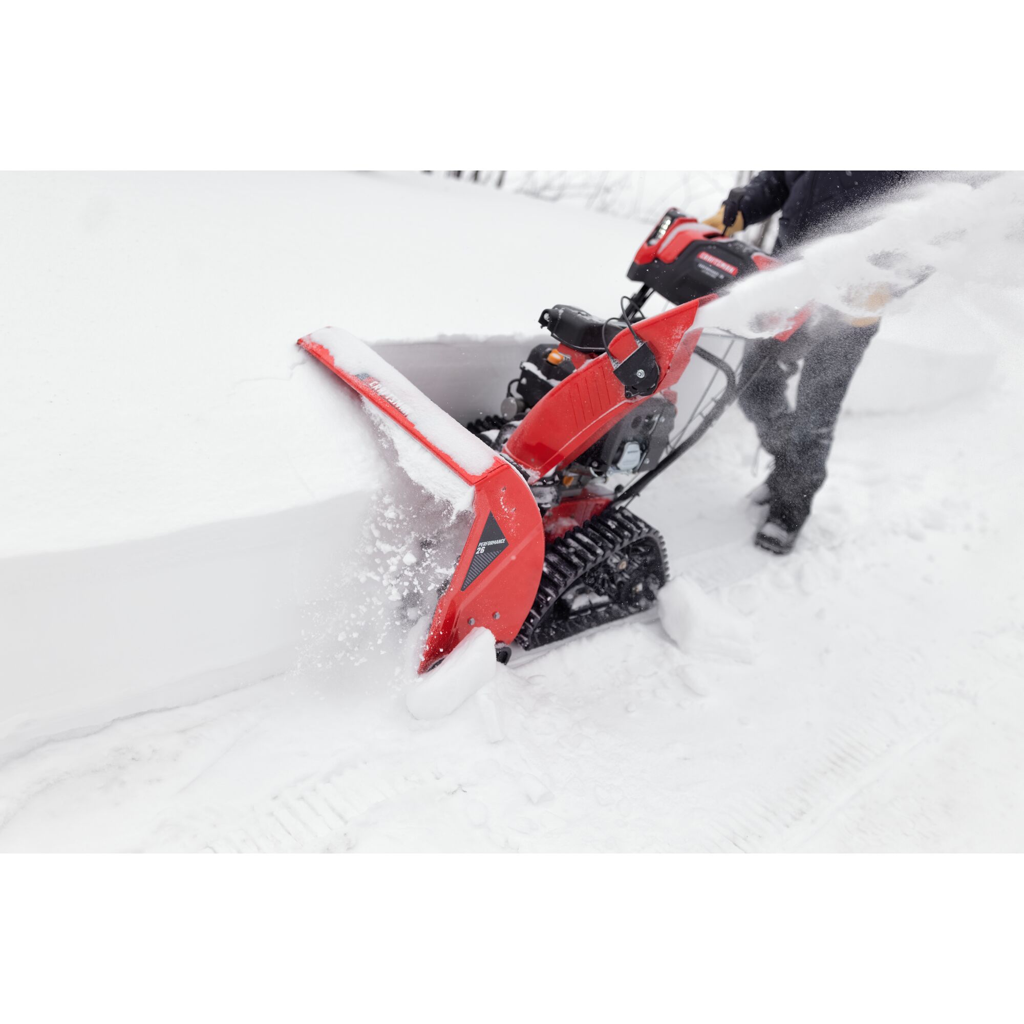 CRAFTSMAN Performance 26 Track Snowblower clearing tall snow off driveway