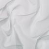 White textile sheet, soft woven fabric, draped and crumpled into gentle folds and creases, creating subtle shadows; close-up view with diffuse, neutral lighting suggesting bedding or a fabric sample.