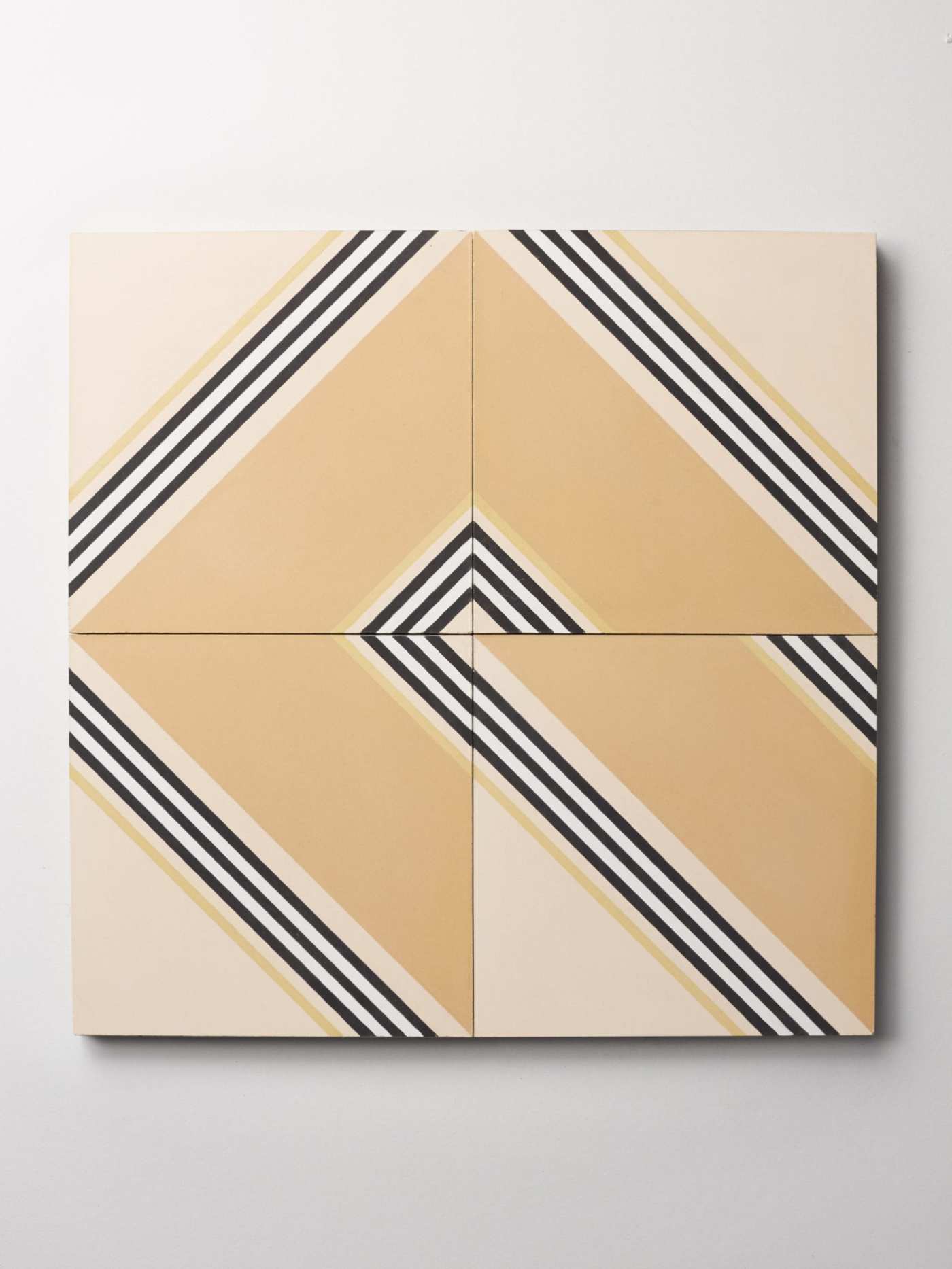 four tiles with black and white stripes on them.