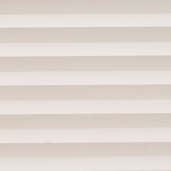 Horizontal cellular blinds with alternating beige and off-white pleats, closed and filtering soft daylight; they cover a window within a neutral interior, producing even, diffuse light and no view.