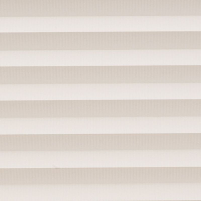 Horizontal cellular blinds with alternating beige and off-white pleats, closed and filtering soft daylight; they cover a window within a neutral interior, producing even, diffuse light and no view.