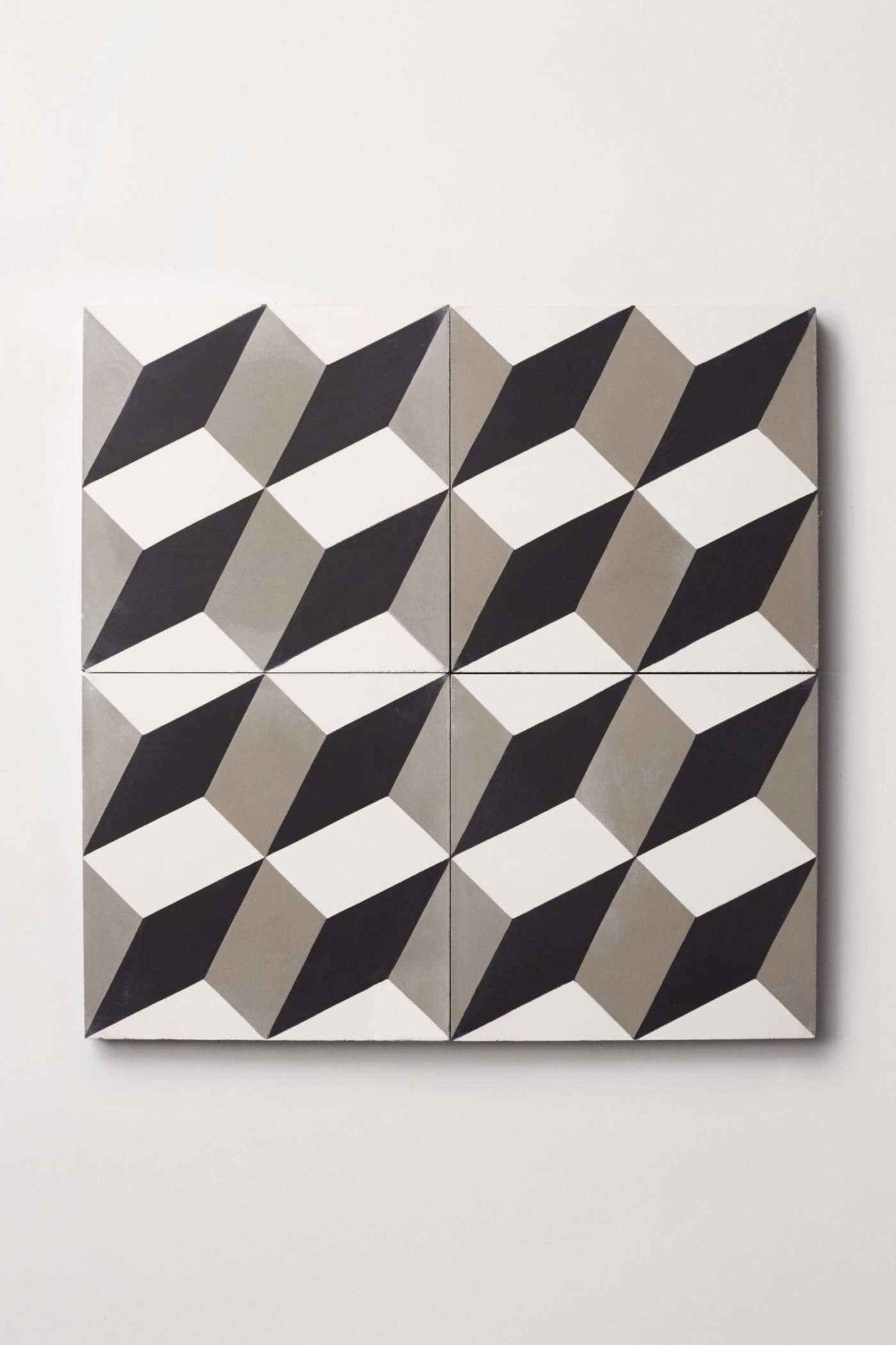 a set of tiles with grey and white geometric designs.