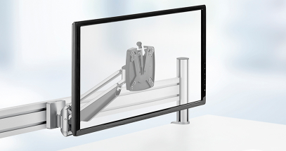 Lift a monitor off the desk surface to maximize space.