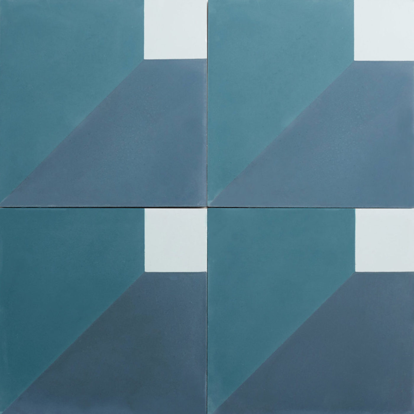 four tiles with blue and white squares on them.