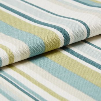 Woven striped fabric (teal, light blue, lime, white) folded in overlapping layers, displaying textured knit and rounded edges, close-up studio shot with soft, even lighting on a neutral surface.