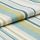 Woven striped fabric (teal, light blue, lime, white) folded in overlapping layers, displaying textured knit and rounded edges, close-up studio shot with soft, even lighting on a neutral surface.