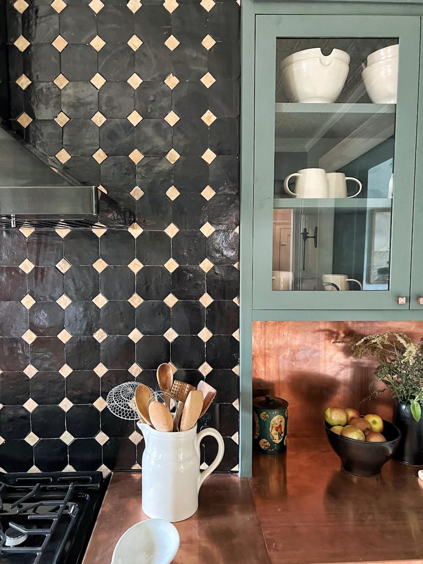 a black and white tiled backsplash in a kitchen.