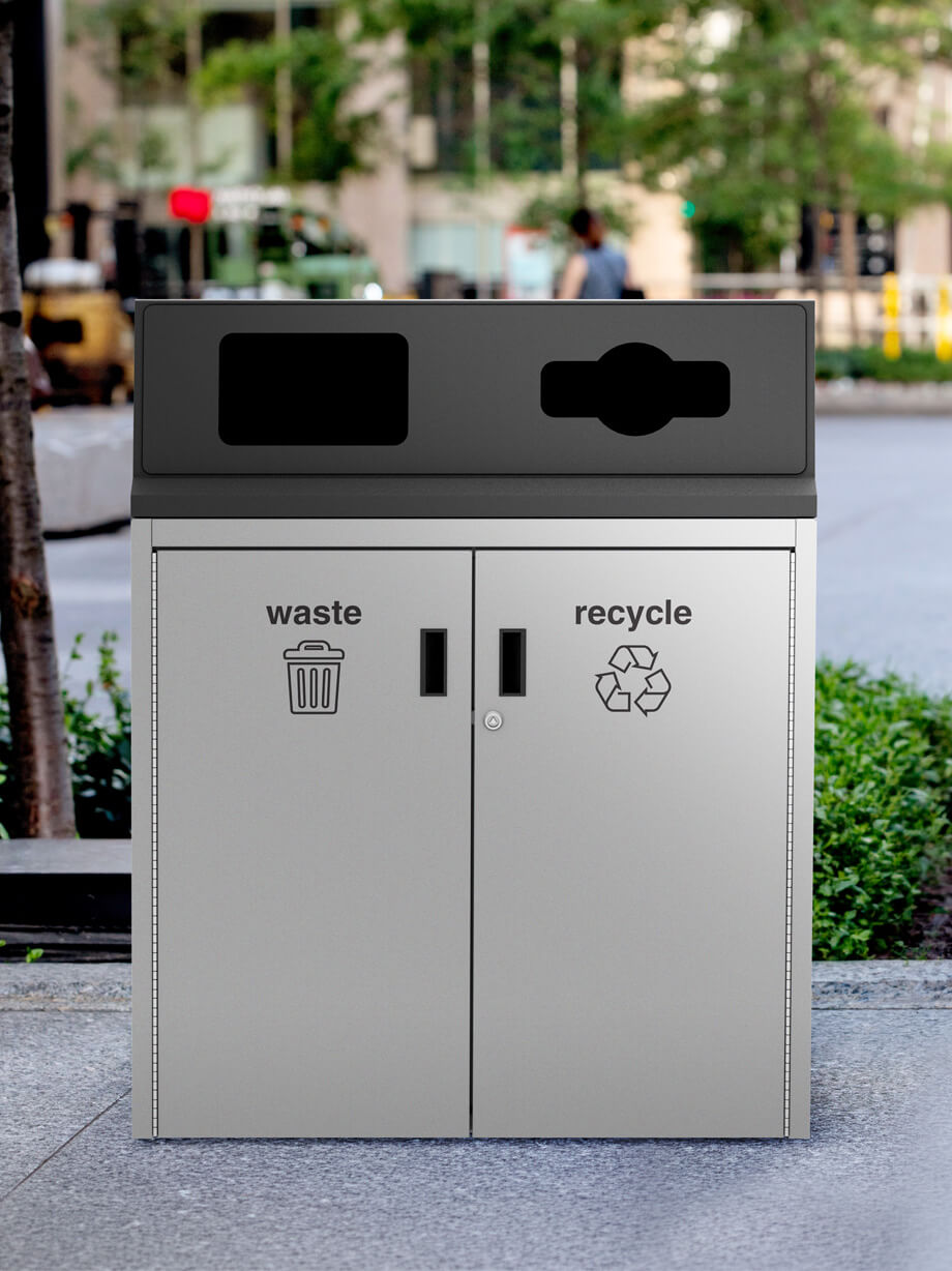 all metal grey and black waste and recycling bin on a downtown city sidewalk