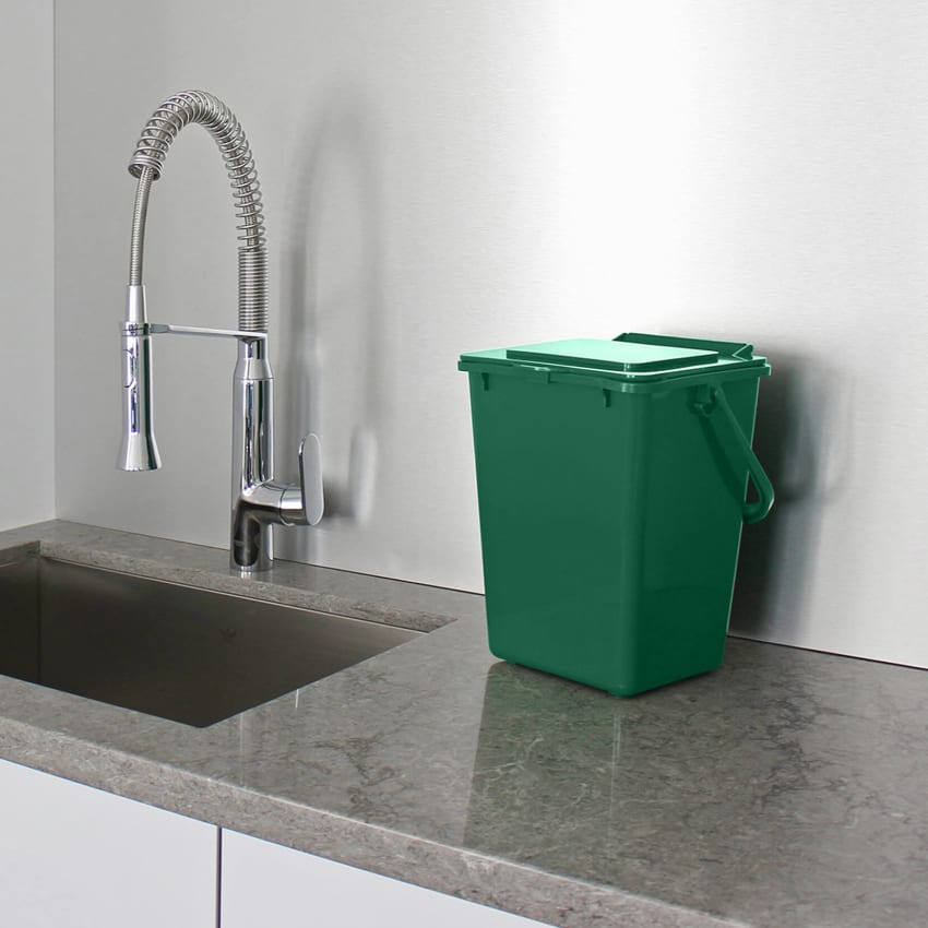 100% post consumer recycled plastic green bin for collecting organics sitting on a kitchen counter top