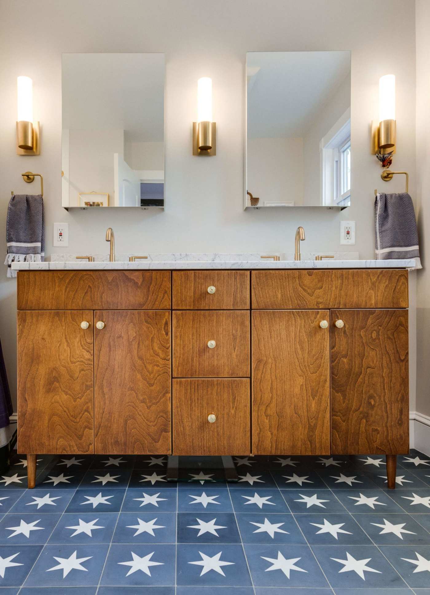 a bathroom with blue and white stars on the floor.