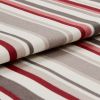 Striped woven fabric folded over itself, featuring red, gray, beige and white horizontal bands; textured knit surface; close-up product-style shot with soft, even lighting and shallow depth of field.