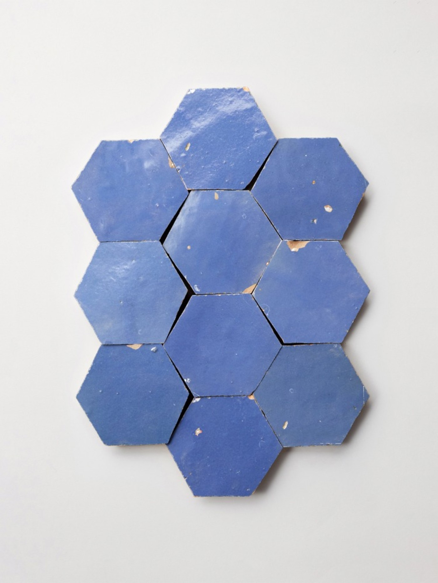 blue hexagon tiles on a white surface.