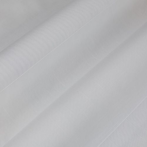 Object: white semi-sheer fabric (curtain-like) with stitched hem and faint grid texture. Action: layered into broad diagonal folds. Context: close-up view, soft diffuse lighting, neutral background.