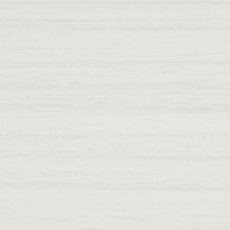 Pale, horizontally striated off-white surface (wall or paper) fills the frame; unmarked and stationary, serving as a neutral, evenly lit backdrop with soft, diffuse light.