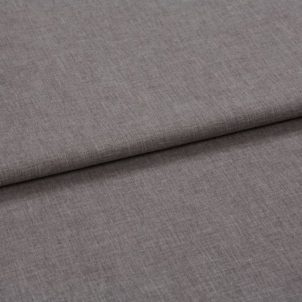 Grey woven fabric panel, folded horizontally with a visible overlapping seam; folded flat and layered, showing fine linen-like texture under soft diffuse lighting in a close-up, neutral setting.