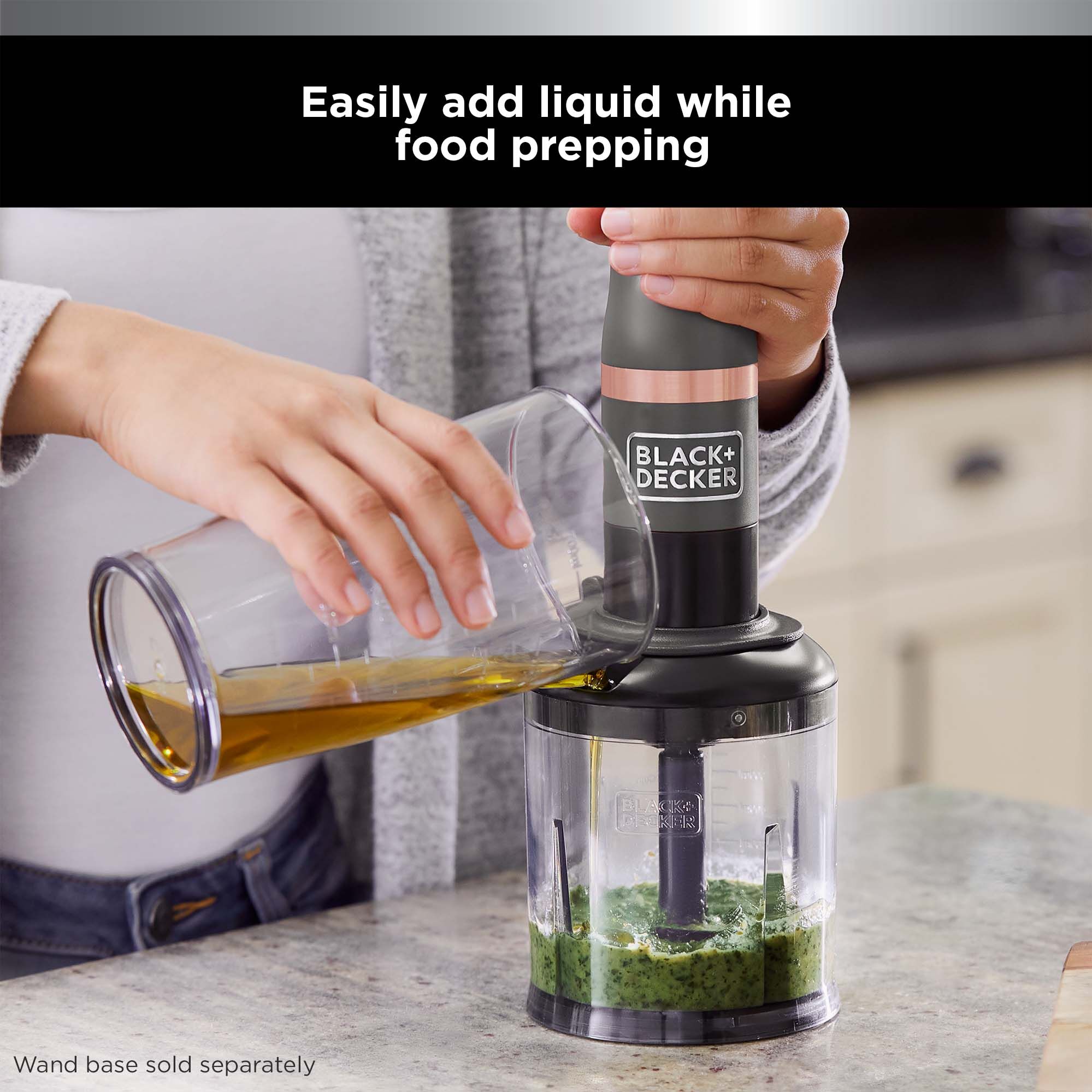 Talent using the liquid port to easily add liquid into the bowl while using the BLACK+DECKER kitchen wand™ food chopper attachment