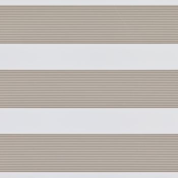 Horizontal dual-layer zebra blinds with beige pleated opaque stripes alternating with white sheer bands, partially filtering and diffusing daylight across a neutral, minimalist interior.