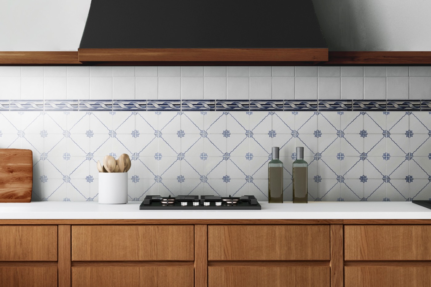 a blue and white tiled backsplash in a kitchen.