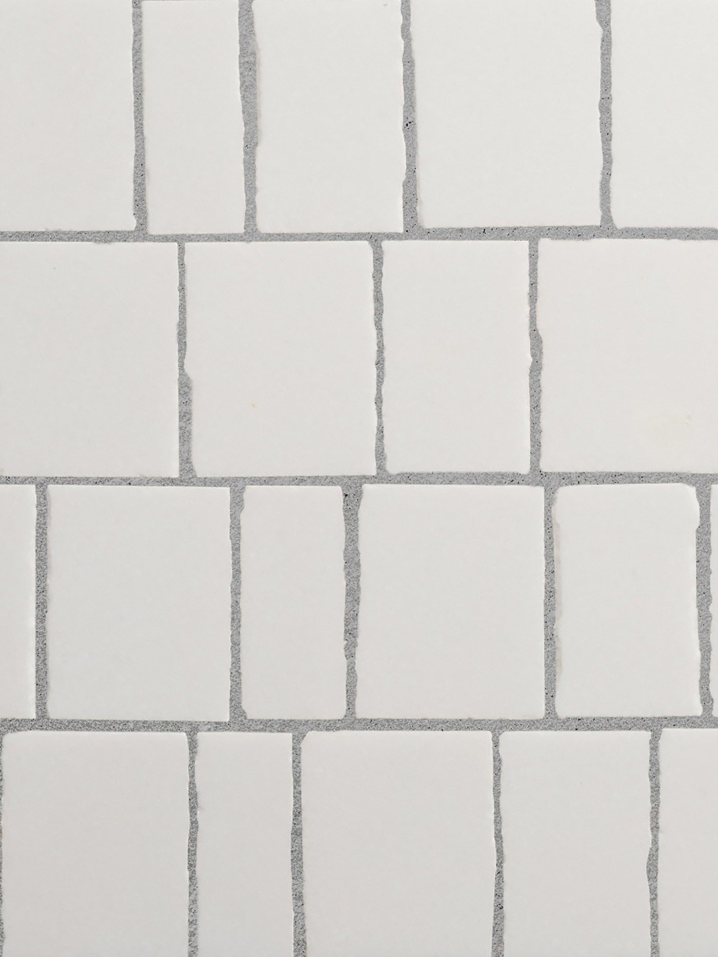 a close up image of a white mosaic tile pieces.