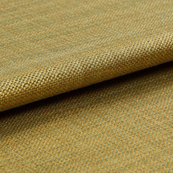 Woven upholstery fabric (gold and teal), small basket-weave pattern, folded over itself; viewed in a close-up macro shot, showing texture and subtle sheen under soft studio lighting.