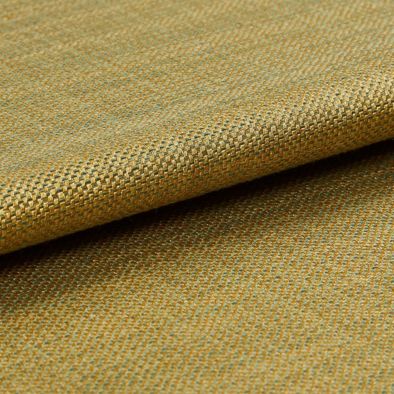 Woven upholstery fabric (gold and teal), small basket-weave pattern, folded over itself; viewed in a close-up macro shot, showing texture and subtle sheen under soft studio lighting.