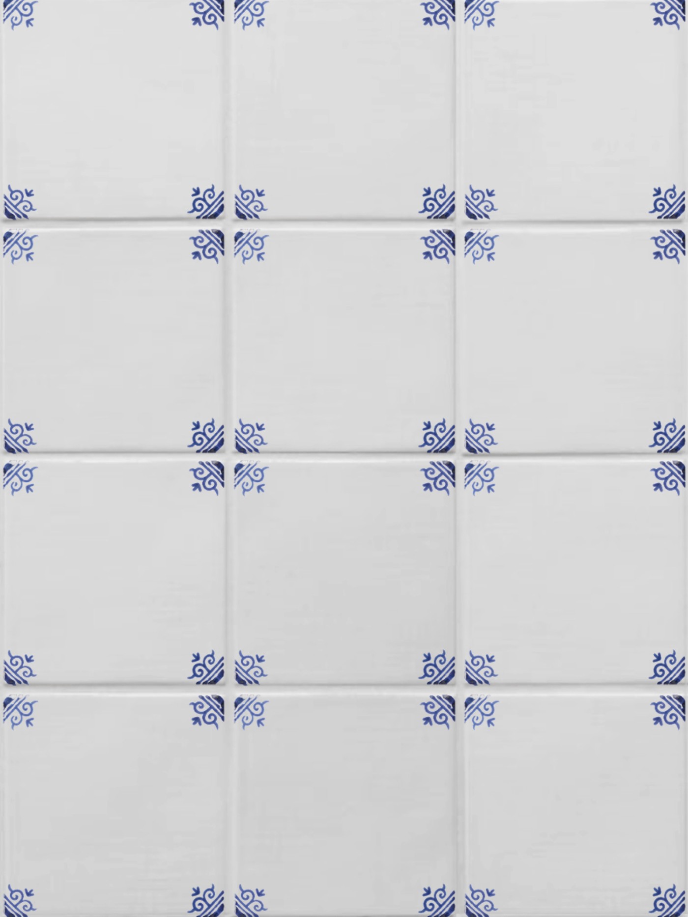 white tiles with hand painted blue designs on them.