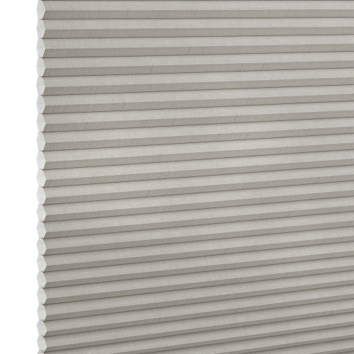 Light-gray pleated cellular window shade, closed with visible honeycomb cells and fabric texture; blocking light and insulating; shown close-up against a neutral, evenly lit backdrop.