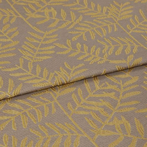 Woven curtain-like fabric with mustard-yellow leaf motif, folded once across the frame and overlapping; close-up view revealing textured taupe weave under soft, even studio lighting.