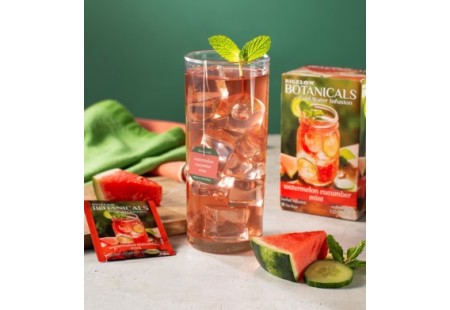 Glass of Watermelon Cucumber Mint Cold Water Infusion with tea box and foil