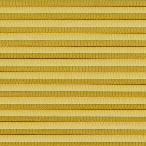 Horizontal cellular (honeycomb) pleated blind, closed with evenly spaced golden-yellow fabric folds and subtle texture; blocking light and insulating, filling the frame under warm diffuse lighting.