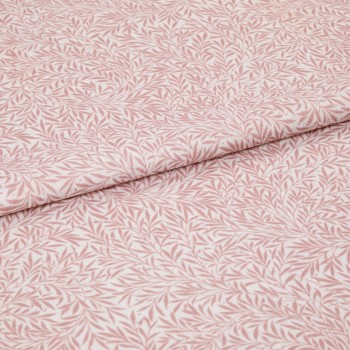 Pink-and-white patterned fabric (leaf print) folded in half and overlapping; close-up flat lay on a neutral surface with soft, even lighting, highlighting woven texture and repeating botanical motif.