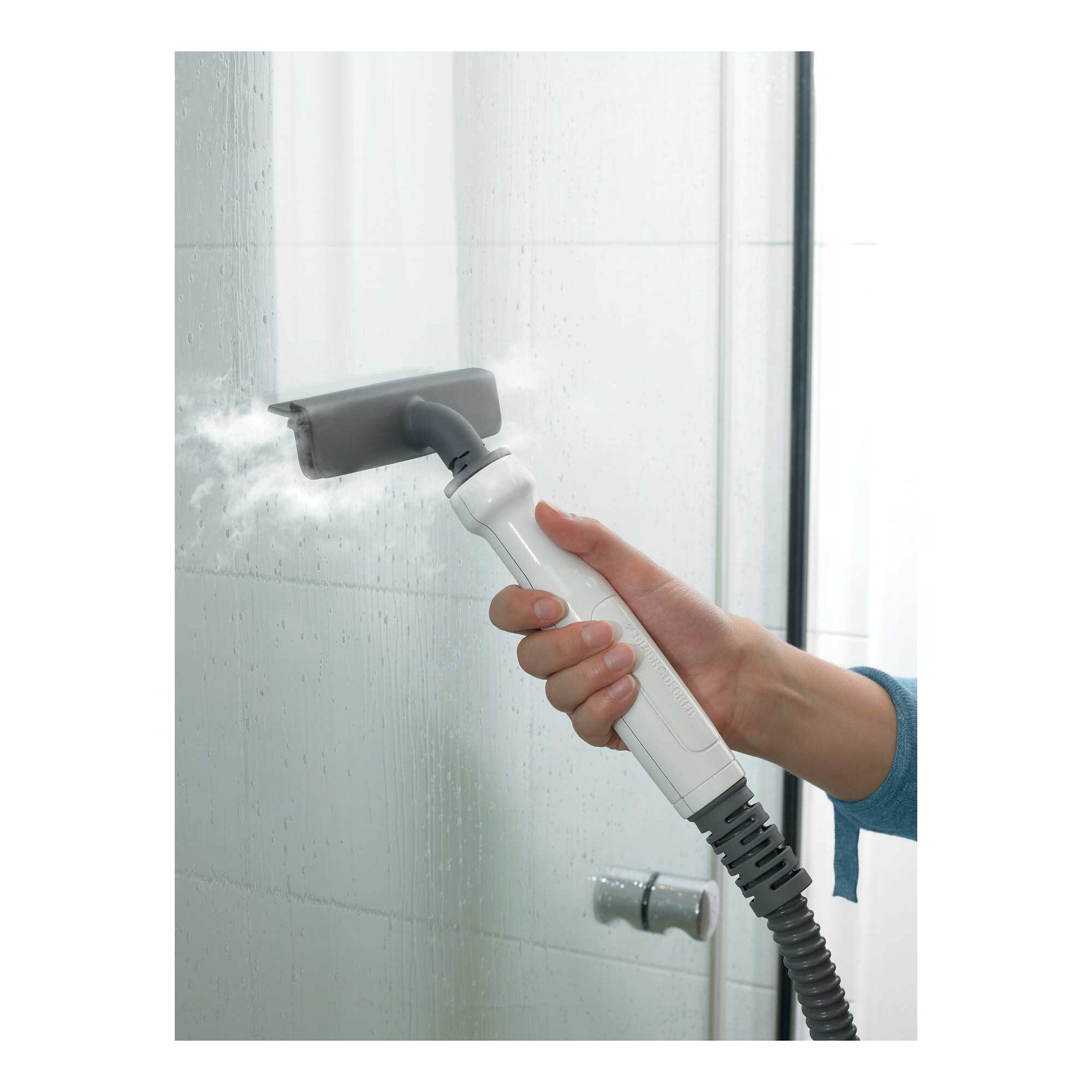 5 in 1 steam mop and portable steamer being used to steam glass doors.