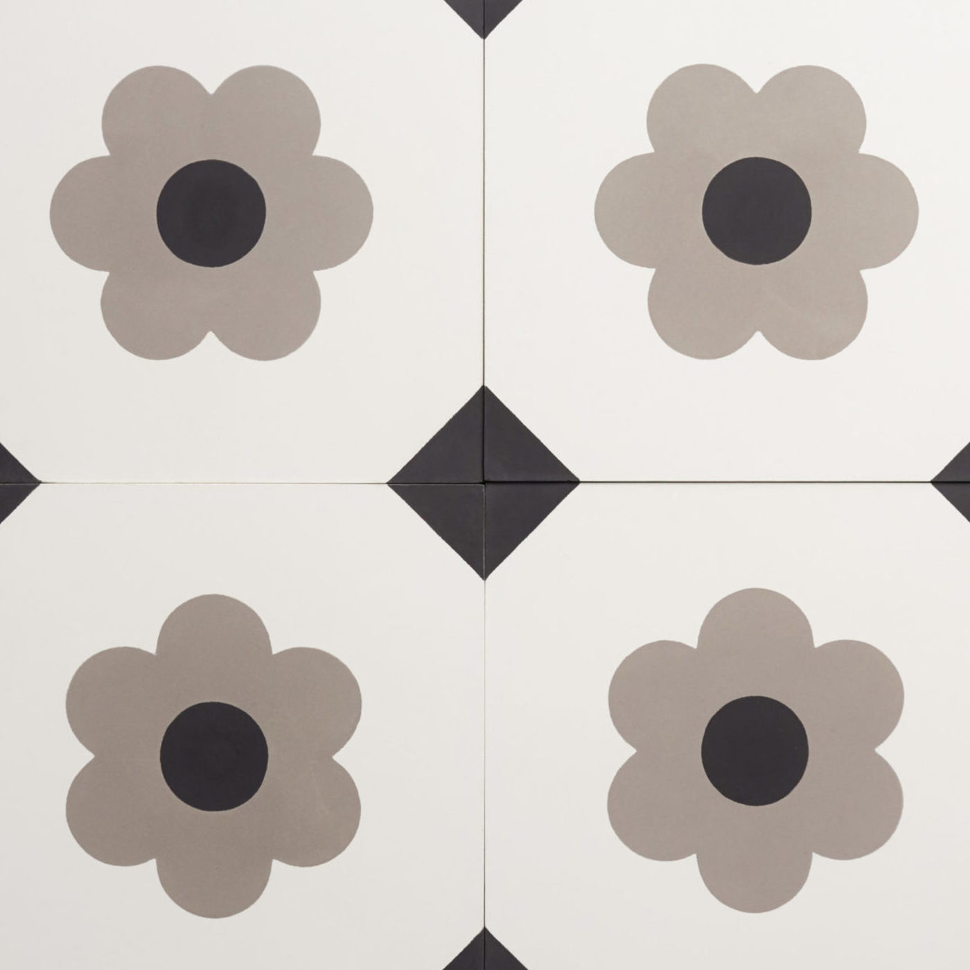 four black and white tiles with flowers on them.