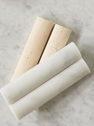 three different types of cheese sticks on a marble surface.